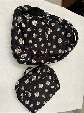 Black Daisy Print Backpack and insulated lunch bag.